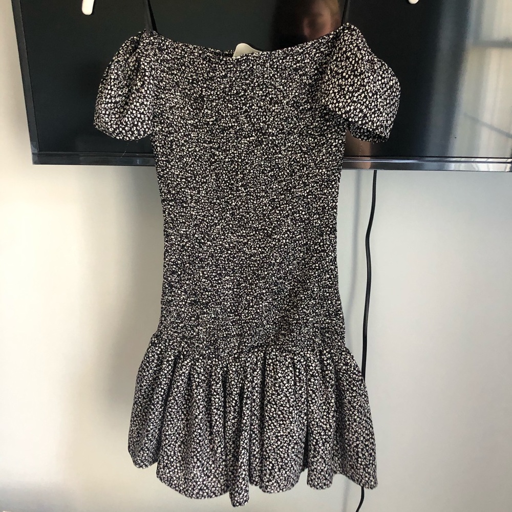 Black smocked dress with flare bottom